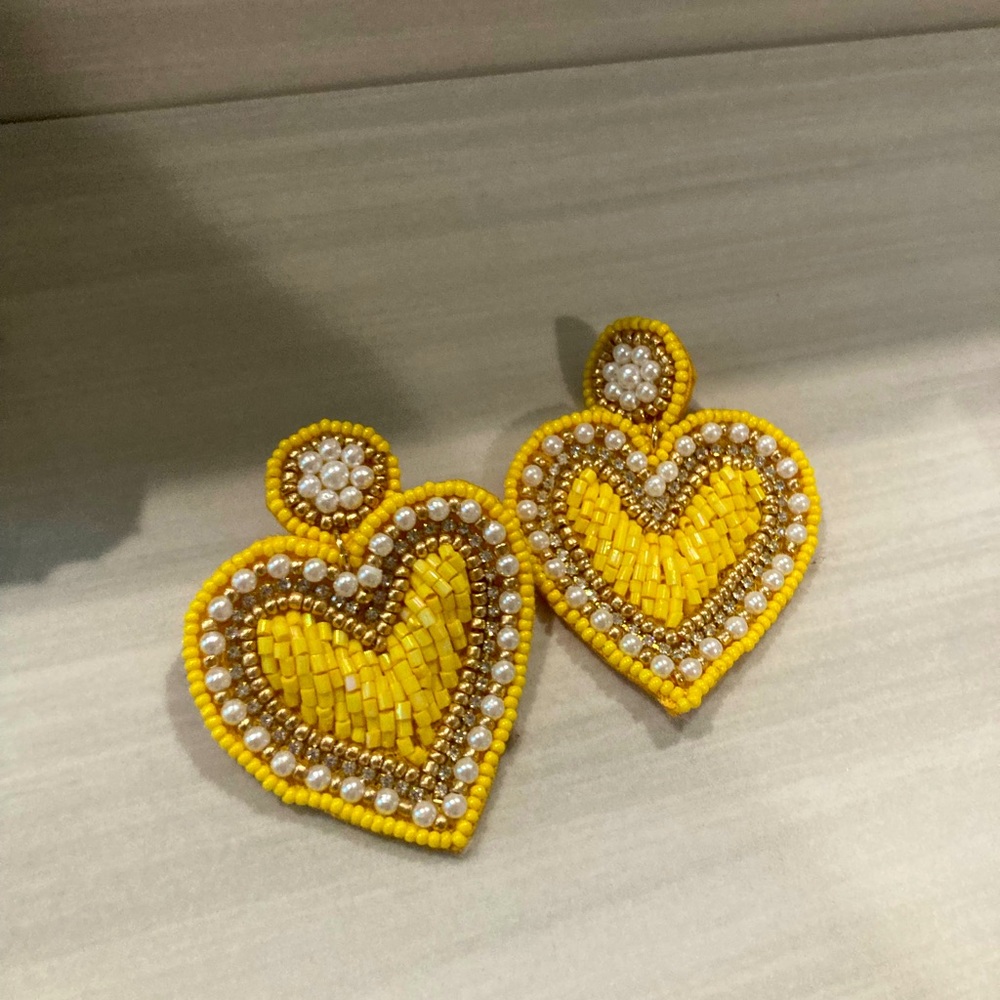 Hand woven and beaded yellow & gold heart earrings. never worn.